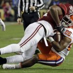 Clemson's Adam Choice is stopped by Alabama's Quinnen Williams during the first half of the NCAA college football playoff championship game Monday, Jan. 7, 2019, in Santa Clara, Calif. (AP Photo/Chris Carlson)