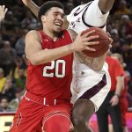 Utah forward Timmy Allen (20) drives to the basket as Arizona State's Zylan Cheatham defends during the second half of an NCAA college basketball game Thursday, Jan. 3, 2019, in Tempe, Ariz. (AP Photo/Ralph Freso)