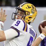 LSU quarterback Joe Burrow (9) warms up prior to the Fiesta Bowl NCAA college football game against UCF Tuesday, Jan. 1, 2019, in Glendale, Ariz. (AP Photo/Ross D. Franklin)