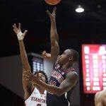 Arizona guard Justin Coleman (12) shoots over Stanford guard Bryce Wills (2) during the first half of an NCAA college basketball game in Stanford, Calif., Wednesday, Jan. 9, 2019. (AP Photo/Jeff Chiu)