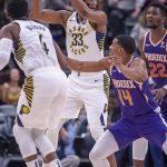 Indiana Pacers center Myles Turner (33) keeps the ball from Phoenix Suns' De'Anthony Melton (14) during the first half of an NBA basketball game Tuesday, Jan. 15, 2019, in Indianapolis. (AP Photo/Doug McSchooler)