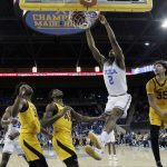 UCLA forward Cody Riley (2) dunks past Arizona State forward Taeshon Cherry, right, and forward Zylan Cheatham (45) during the first half of an NCAA college basketball game Thursday, Jan. 24, 2019, in Los Angeles. (AP Photo/Marcio Jose Sanchez)