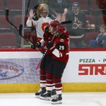 Arizona Coyotes left wing Lawson Crouse, left, celebrates his goal against the San Jose Sharks with right wing Mario Kempe (29) during the first period of an NHL hockey game Wednesday, Jan. 16, 2019, in Glendale, Ariz. (AP Photo/Ross D. Franklin)