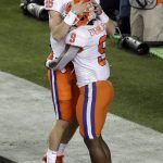 Clemson's Travis Etienne (9) celebrates his touchdown run with Trevor Lawrence (16) during the first half the NCAA college football playoff championship game against Alabama, Monday, Jan. 7, 2019, in Santa Clara, Calif. (AP Photo/Jeff Chiu)