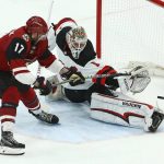 New Jersey Devils goaltender Keith Kinkaid (1) makes a save on a shot by Arizona Coyotes center Alex Galchenyuk (17) during the shootout in an NHL hockey game Friday, Jan. 4, 2019, in Glendale, Ariz. The Devils won 3-2. (AP Photo/Ross D. Franklin)