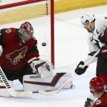 Arizona Coyotes goaltender Darcy Kuemper (35) gives up a goal to San Jose Sharks' Logan Couture, not seen, as Sharks center Joe Pavelski (8) and Coyotes defensemen Jordan Oesterle (82) and Niklas Hjalmarsson (4) watch during the third period of an NHL hockey game Wednesday, Jan. 16, 2019, in Glendale, Ariz. The Coyotes defeated the Sharks 6-3. (AP Photo/Ross D. Franklin)