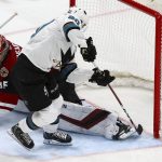 Arizona Coyotes goaltender Darcy Kuemper (35) slides over to make a save on a shot by San Jose Sharks left wing Marcus Sorensen (20) during the second period of an NHL hockey game Wednesday, Jan. 16, 2019, in Glendale, Ariz. (AP Photo/Ross D. Franklin)
