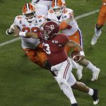 Alabama's Tua Tagovailoa is stopped on a fourth and goal play during the second half of the NCAA college football playoff championship game against Clemson, Monday, Jan. 7, 2019, in Santa Clara, Calif. (AP Photo/Jeff Chiu)