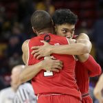 Utah guard Sedrick Barefield, right, embraces teammate Charles Jones (1) following the team's 96-86 victory over Arizona State during an NCAA college basketball game, Thursday, Jan. 3, 2019, in Tempe, Ariz. (AP Photo/Ralph Freso)