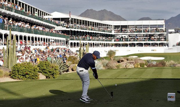 Harold Varner III hits from the 16th tee during the first round of the Phoenix Open PGA golf tourna...