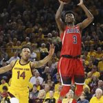 Arizona guard Dylan Smith (3) drives past Arizona State forward Kimani Lawrence (14) during the first half of an NCAA college basketball game Thursday, Jan. 31, 2019, in Tempe, Ariz. (AP Photo/Ross D. Franklin)