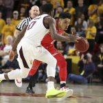 Utah guard Sedrick Barefield, right, advances the ball up court as Arizona State's Luguentz Dort (0) defends during the first half of an NCAA college basketball game, Thursday, Jan. 3, 2019, in Tempe, Ariz. (AP Photo/Ralph Freso)