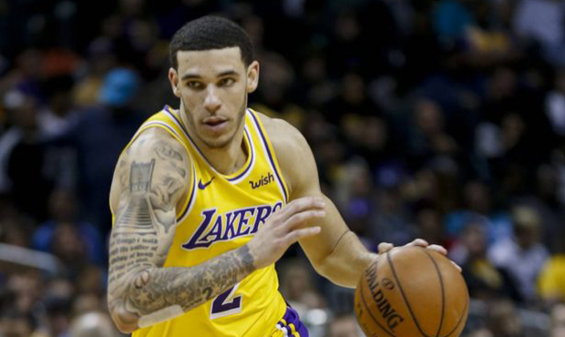 Los Angeles Lakers guard Lonzo Ball drives against the Charlotte Hornets in the second half of an N...