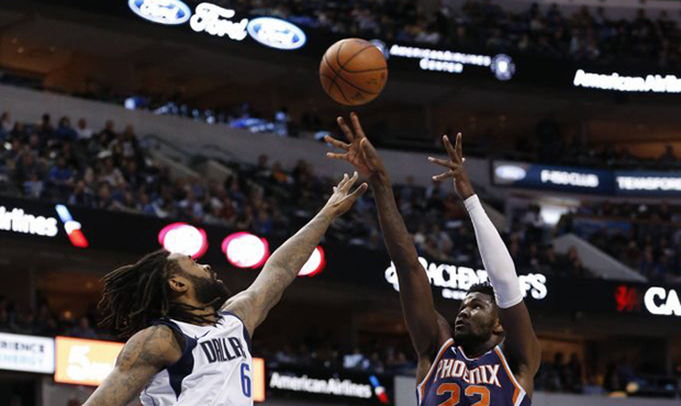 Phoenix Suns center Deandre Ayton (22) shoots over Dallas Mavericks center DeAndre Jordan (6) durin...