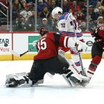 New York Rangers center Filip Chytil (72) attempts to shoot the puck past Arizona Coyotes goalie Darcy Kuemper (35) as Arizona Coyotes' Alex Goligoski (33) defends during the second period of an NHL hockey game, Sunday, Jan. 6, 2019, in Glendale, Ariz. (AP Photo/Ralph Freso)