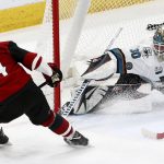 San Jose Sharks goaltender Aaron Dell (30) makes a save on a shot by Arizona Coyotes right wing Richard Panik (14) during the second period of an NHL hockey game Wednesday, Jan. 16, 2019, in Glendale, Ariz. (AP Photo/Ross D. Franklin)