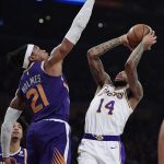 Los Angeles Lakers forward Brandon Ingram, right, shoots as Phoenix Suns forward Richaun Holmes defends during the first half of an NBA basketball game Sunday, Jan. 27, 2019, in Los Angeles. (AP Photo/Mark J. Terrill)