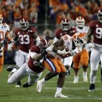 Clemson's Tavien Feaster is stopped during the first half the NCAA college football playoff championship game against Alabama, Monday, Jan. 7, 2019, in Santa Clara, Calif. (AP Photo/David J. Phillip)