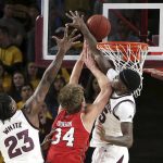 Arizona State's Zylan Cheatham, right, and Romello White (23) defend the shot of Utah center Jayce Johnson during the second half of an NCAA college basketball game Thursday, Jan. 3, 2019, in Tempe, Ariz. (AP Photo/Ralph Freso)