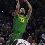 Oregon's Paul White (13) puts up a shot against Arizona State's Zylan Cheatham (45) during the first half of an NCAA college basketball game Saturday, Jan. 19, 2019, in Tempe, Ariz. (AP Photo/Darryl Webb)