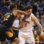 
              Los Angeles Clippers forward Danilo Gallinari is fouled by Phoenix Suns forward T.J. Warren (12) in the first half during an NBA basketball game, Friday, Jan. 4, 2019, in Phoenix. (AP Photo/Rick Scuteri)
            