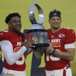 AFC safety Jamal Adams (33), of the New York Jets, left, and AFC quarterback Patrick Mahomes (15), of the Kansas City Chiefs, hold the trophy after being named MVP's during the NFL Pro Bowl football game Sunday, Jan. 27, 2019, in Orlando, Fla. (AP Photo/Mark LoMoglio)