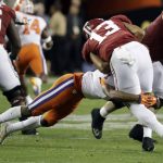 Alabama's Tua Tagovailoa is sacked by Clemson's Trayvon Mullen during the first half of the NCAA college football playoff championship game Monday, Jan. 7, 2019, in Santa Clara, Calif. (AP Photo/Chris Carlson)