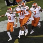 Clemson's A.J. Terrell (8) is congratulated after intercepting a pass and returning it for a touchdown during the first half the NCAA college football playoff championship game against Alabama, Monday, Jan. 7, 2019, in Santa Clara, Calif. (AP Photo/Jeff Chiu)