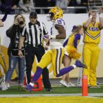 LSU wide receiver Derrick Dillon (19) scores a touchdown against UCF during the first half of the Fiesta Bowl NCAA college football game, Tuesday, Jan. 1, 2019, in Glendale, AZ. (AP Photo/Rick Scuteri)