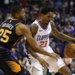 
              Phoenix Suns forward Mikal Bridges (25) knocks the ball away from Los Angeles Clippers guard Lou Williams in the first half during an NBA basketball game, Friday, Jan. 4, 2019, in Phoenix. (AP Photo/Rick Scuteri)
            