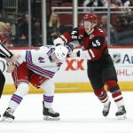 Arizona Coyotes right winger Josh Archibald (45) and New York Rangers defenseman Neal Pionk (44) scuffle during the second period of an NHL hockey game, Sunday, Jan. 6, 2019, in Glendale, Ariz. (AP Photo/Ralph Freso)