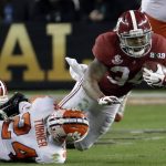 Alabama's Damien Harris is stopped during the second half of the NCAA college football playoff championship game against Clemson, Monday, Jan. 7, 2019, in Santa Clara, Calif. (AP Photo/Chris Carlson)