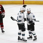 San Jose Sharks right wing Kevin Labanc (62) celebrates his goal against the Arizona Coyotes with Sharks right wing Barclay Goodrow (23) as Coyotes defenseman Ilya Lyubushkin (46) skates away during the first period of an NHL hockey game Wednesday, Jan. 16, 2019, in Glendale, Ariz. (AP Photo/Ross D. Franklin)