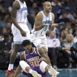 Charlotte Hornets' Tony Parker (9) reacts to being called for a foul against Phoenix Suns' Troy Daniels (30) during the first half of an NBA basketball game in Charlotte, N.C., Saturday, Jan. 19, 2019. (AP Photo/Chuck Burton)
