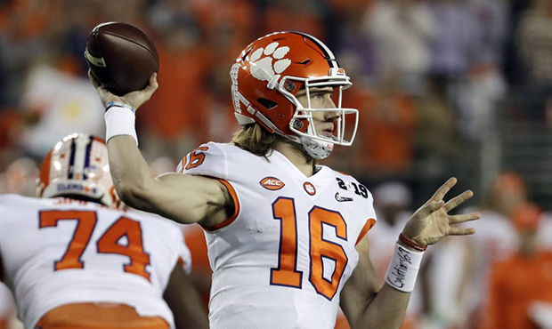 Clemson's Trevor Lawrence throws during the first half the NCAA college football playoff championsh...