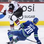 Arizona Coyotes' Ilya Lyubushkin (46), of Russia, and Vancouver Canucks' Brandon Sutter (20) collide during the second period of an NHL hockey game Thursday, Jan. 10, 2019, in Vancouver, British Columbia. (Darryl Dyck/The Canadian Press via AP)