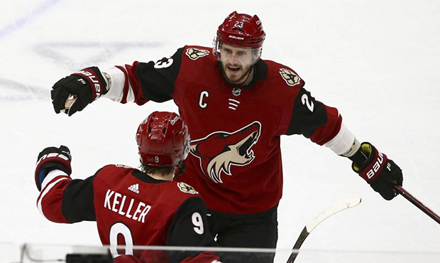 Arizona Coyotes center Clayton Keller (9) celebrates his goal against the Pittsburgh Penguins with ...