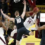 Arizona State forward Kimani Lawrence (14) tries to pass the ball under the basket around the defense of Colorado's Alexander Strating (10) during the first half of an NCAA college basketball game, Saturday, Jan. 5, 2019, in Tempe, Ariz. (AP Photo/Ralph Freso)