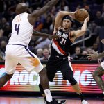 Portland Trail Blazers guard Seth Curry (31) looks to pass the ball as Phoenix Suns forward Quincy Acy (4) defends during the second half of an NBA basketball game Thursday, Jan. 24, 2019, in Phoenix. (AP Photo/Matt York)