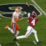 Alabama's Jerry Jeudy catches a touchdown pass in front of Clemson's Tanner Muse during the first half the NCAA college football playoff championship game, Monday, Jan. 7, 2019, in Santa Clara, Calif. (AP Photo/Jeff Chiu)