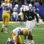 UCF linebacker Nate Evans (44) gets called for taunting LSU quarterback Joe Burrow (9) after an interception in the first half during the Fiesta Bowl NCAA college football game, Tuesday, Jan. 1, 2019, in Glendale, Ariz. (AP Photo/Rick Scuteri)