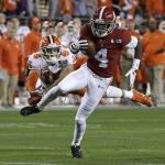 Alabama's Jerry Jeudy catches a touchdown pass in front of Clemson's Tanner Muse during the first half the NCAA college football playoff championship game, Monday, Jan. 7, 2019, in Santa Clara, Calif. (AP Photo/Chris Carlson)