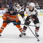 Arizona Coyotes ' Nick Cousins (25) is chased by Edmonton Oilers' Ryan Nugent-Hopkins (93) during the first period of an NHL hockey game Saturday, Jan. 12, 2019, in Edmonton Alberta. (Jason Franson/The Canadian Press via AP)