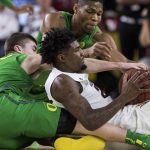 Arizona State's Romello White (23) controls the ball as he battles against Oregon's Payton Pritchard (3) and Francis Okoro (33) during the first half of an NCAA college basketball game Saturday, Jan. 19, 2019, in Tempe, Ariz. (AP Photo/Darryl Webb)