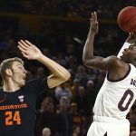 Arizona State guard Luguentz Dort (0) gets off a shot over Oregon State forward Kylor Kelley (24) during the second half of an NCAA college basketball game Thursday, Jan. 17, 2019, in Tempe, Ariz. Arizona State won 70-67. (AP Photo/Ross D. Franklin)
