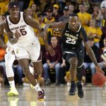 Colorado guard McKinley Wright (25) advances the ball up the court past Arizona State's Zylan Cheatman during the first half of an NCAA college basketball game, Saturday, Jan. 5, 2019, in Tempe, Ariz. (AP Photo/Ralph Freso)