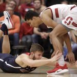 Arizona forward Ryan Luther, left, reaches for the ball under Stanford forward Oscar da Silva during the first half of an NCAA college basketball game in Stanford, Calif., Wednesday, Jan. 9, 2019. (AP Photo/Jeff Chiu)