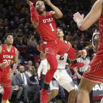 Utah guard Charles Jones (1) drives to the basket past the defense of Arizona State's Rob Edwards (2) during the first half of an NCAA college basketball game, Thursday, Jan. 3, 2019, in Tempe, Ariz. (AP Photo/Ralph Freso)