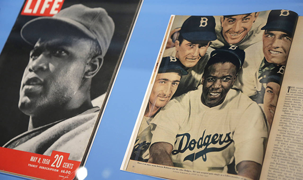 In this Tuesday, Jan. 29, 2019 photo, news articles about Brooklyn Dodgers baseball player Jackie R...