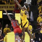Arizona State forward Zylan Cheatham (45) blocks a shot by Arizona guard Justin Coleman (12) during the second half of an NCAA college basketball game Thursday, Jan. 31, 2019, in Tempe, Ariz. Arizona State won 95-88 in overtime. (AP Photo/Ross D. Franklin)